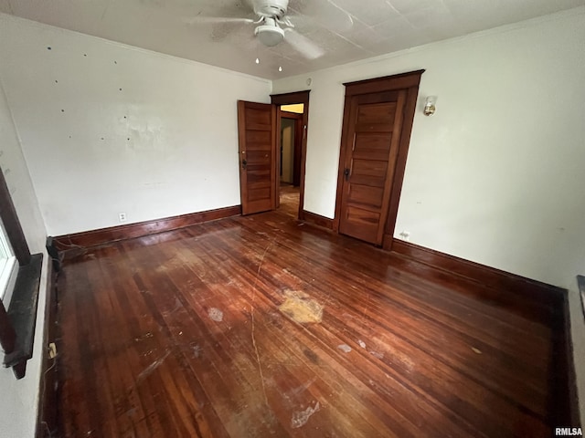 421 W 17th St, Davenport, IA 52803 - unfurnished bedroom with wood-type flooring and a ceiling fan