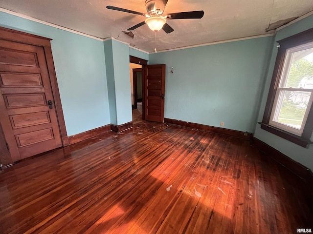 421 W 17th St, Davenport, IA 52803 - unfurnished bedroom with hardwood / wood-style flooring, crown molding, and ceiling fan