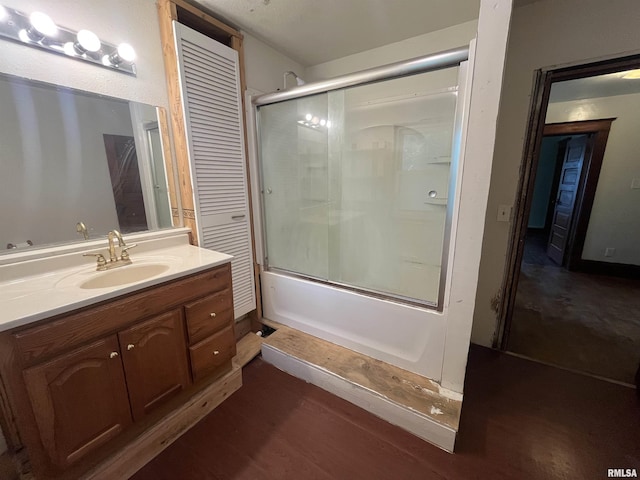 421 W 17th St, Davenport, IA 52803 - full bath with vanity, enclosed tub / shower combo, and wood finished floors