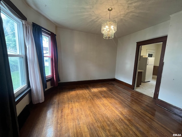 421 W 17th St, Davenport, IA 52803 - empty room with wood finished floors and a chandelier
