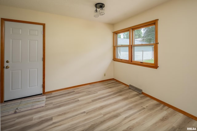 3403 Kimberly Downs Rd, Davenport, IA 52807 - spare room featuring light wood-style flooring