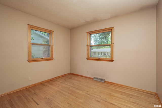 3403 Kimberly Downs Rd, Davenport, IA 52807 - unfurnished room featuring light wood finished floors and healthy amount of natural light