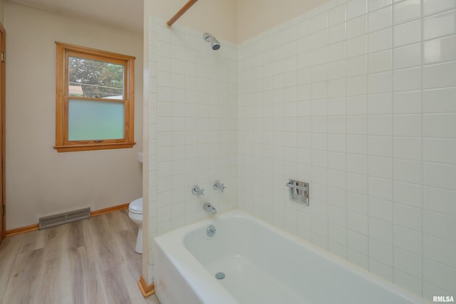 3403 Kimberly Downs Rd, Davenport, IA 52807 - bathroom with wood finished floors and bathtub / shower combination
