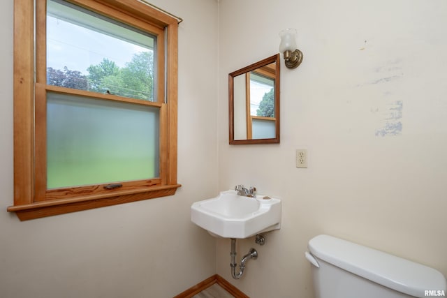 3403 Kimberly Downs Rd, Davenport, IA 52807 - bathroom with toilet and baseboards
