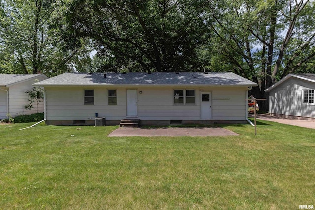 3403 Kimberly Downs Rd, Davenport, IA 52807 - back of property featuring a lawn, a patio area, entry steps, and roof with shingles