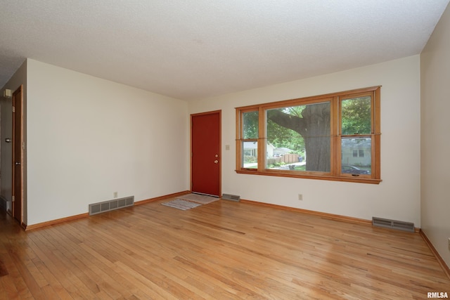 3403 Kimberly Downs Rd, Davenport, IA 52807 - empty room featuring light wood-style flooring and baseboards