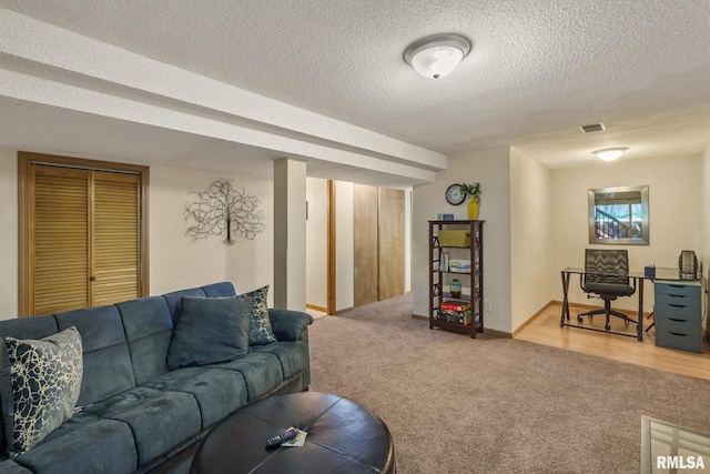 493 44th Avenue Ct, East Moline, IL 61244 - living area featuring carpet floors and a textured ceiling