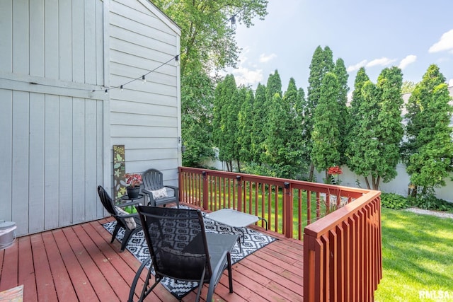 493 44th Avenue Ct, East Moline, IL 61244 - wooden deck featuring outdoor dining area and a lawn
