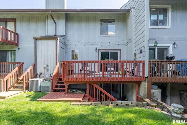 493 44th Avenue Ct, East Moline, IL 61244 - rear view of house with stairway, a wooden deck, and a yard