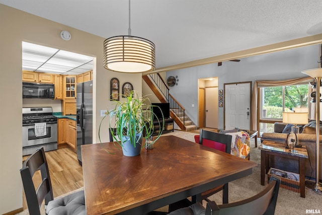 493 44th Avenue Ct, East Moline, IL 61244 - dining room with stairs and light wood-type flooring