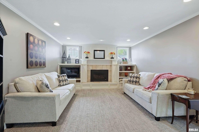 4444 Spring St, Davenport, IA 52807 - living area featuring recessed lighting, healthy amount of natural light, a tiled fireplace, crown molding, and carpet flooring