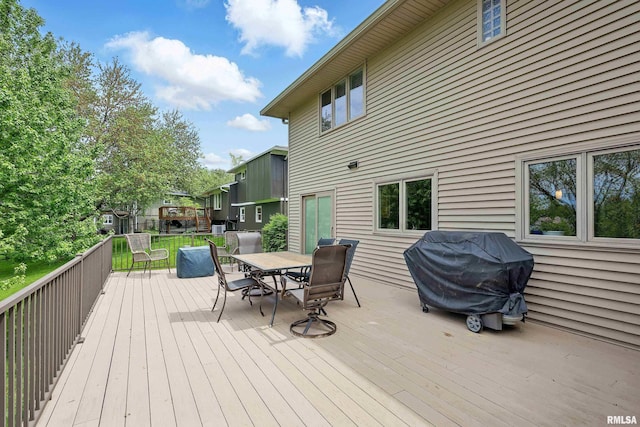 4444 Spring St, Davenport, IA 52807 - wooden terrace with outdoor dining area and grilling area