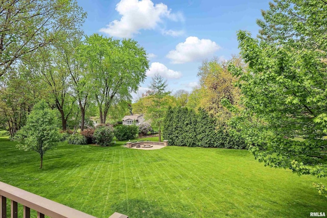 4444 Spring St, Davenport, IA 52807 - view of grassy yard featuring an outdoor fire pit