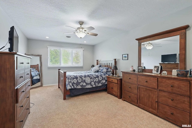 4444 Spring St, Davenport, IA 52807 - bedroom featuring light carpet, a textured ceiling, and a ceiling fan