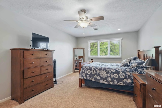 4444 Spring St, Davenport, IA 52807 - bedroom with light colored carpet, a textured ceiling, and a ceiling fan