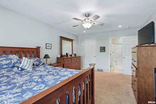 4444 Spring St, Davenport, IA 52807 - bedroom with light colored carpet, recessed lighting, ensuite bathroom, and a ceiling fan