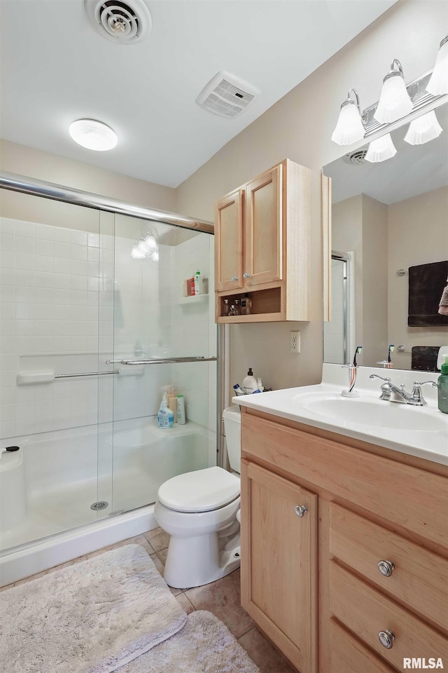 4444 Spring St, Davenport, IA 52807 - full bathroom featuring vanity, a stall shower, and tile patterned flooring