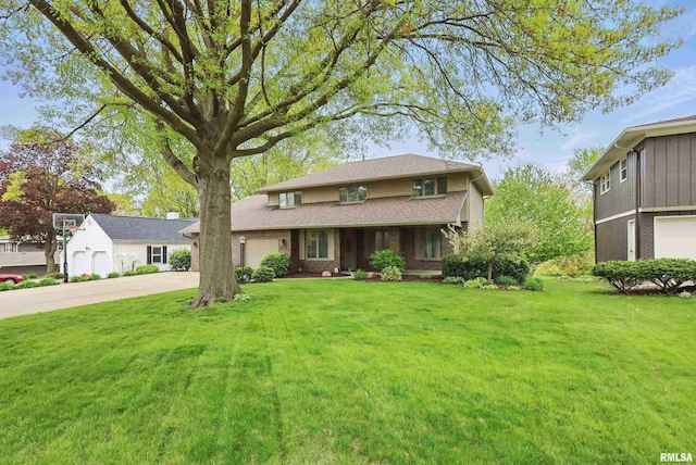 4444 Spring St, Davenport, IA 52807 - traditional-style home with concrete driveway, a front yard, and an attached garage
