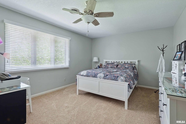4444 Spring St, Davenport, IA 52807 - bedroom featuring light carpet, a ceiling fan, and a textured ceiling