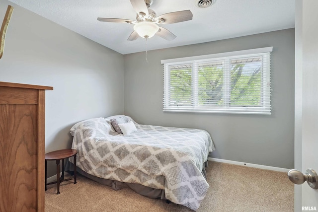 4444 Spring St, Davenport, IA 52807 - carpeted bedroom with baseboards and ceiling fan