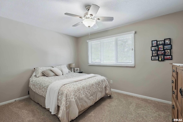 4444 Spring St, Davenport, IA 52807 - bedroom with light colored carpet, ceiling fan, and a textured ceiling