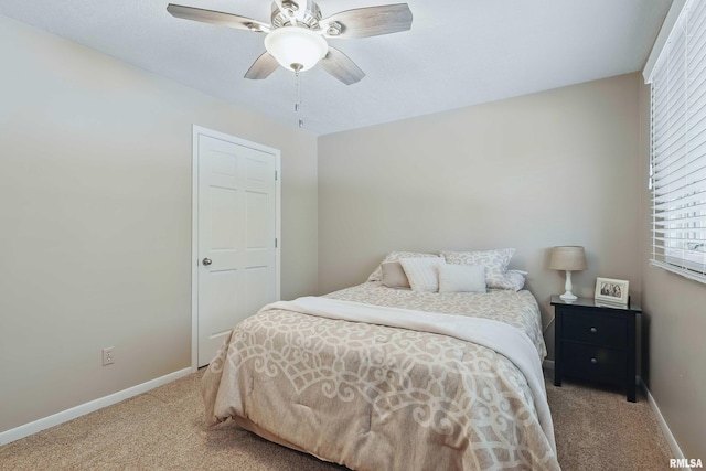 4444 Spring St, Davenport, IA 52807 - carpeted bedroom with multiple windows and a ceiling fan