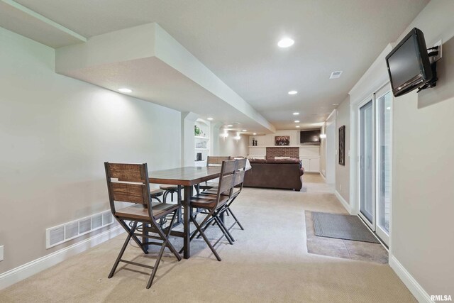 4444 Spring St, Davenport, IA 52807 - dining room featuring light carpet and recessed lighting