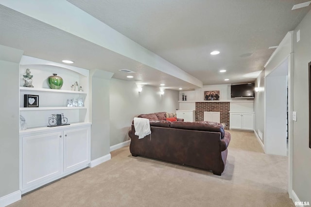 4444 Spring St, Davenport, IA 52807 - living area with light colored carpet, a brick fireplace, recessed lighting, and built in shelves