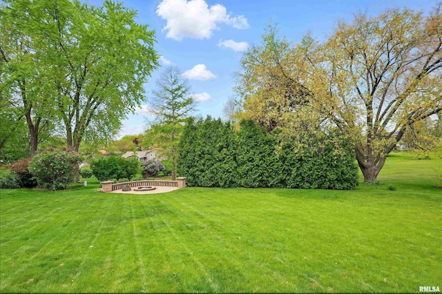 4444 Spring St, Davenport, IA 52807 - view of green lawn with an outdoor fire pit