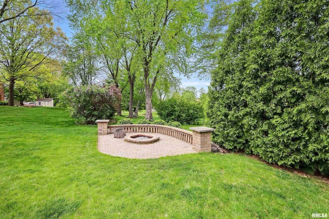 4444 Spring St, Davenport, IA 52807 - view of green lawn with a fire pit