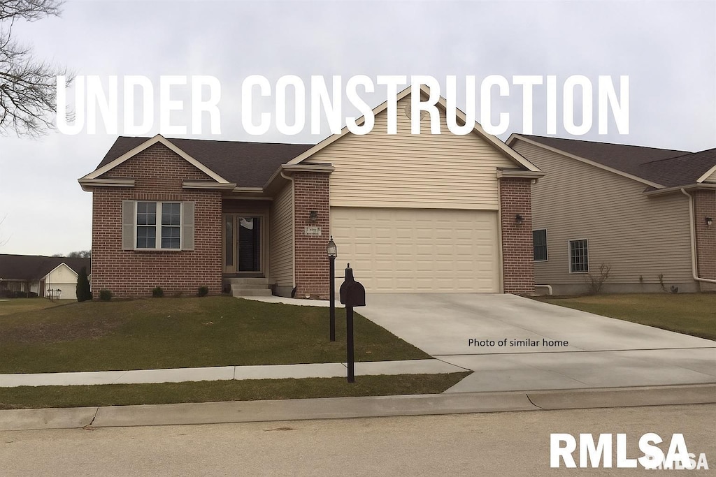 3521 72nd St, Moline, IL 61265 - view of front of home with brick siding, driveway, a garage, and a front yard