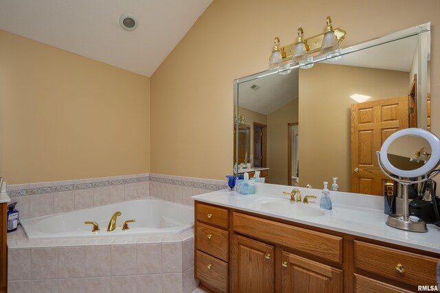 4934 Foxborough Ct, Bettendorf, IA 52722 - bathroom with lofted ceiling, a bath, and vanity