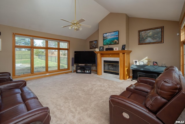 4934 Foxborough Ct, Bettendorf, IA 52722 - carpeted living area featuring vaulted ceiling, ceiling fan, and a tiled fireplace
