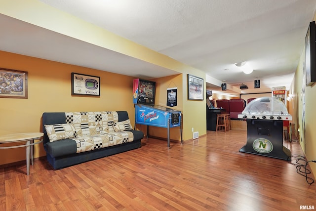 4934 Foxborough Ct, Bettendorf, IA 52722 - rec room featuring wood finished floors and baseboards