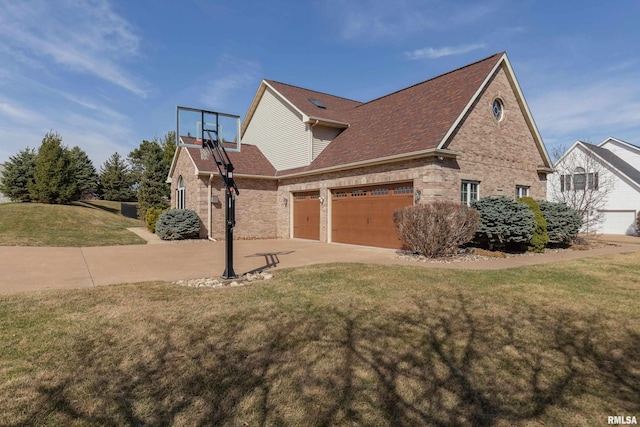 4934 Foxborough Ct, Bettendorf, IA 52722 - view of side of home with brick siding, a lawn, a garage, roof with shingles, and driveway