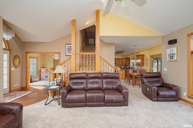 4934 Foxborough Ct, Bettendorf, IA 52722 - living area with vaulted ceiling, stairway, a ceiling fan, and carpet flooring