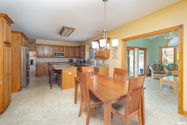 4934 Foxborough Ct, Bettendorf, IA 52722 - dining area with a chandelier and a ceiling fan