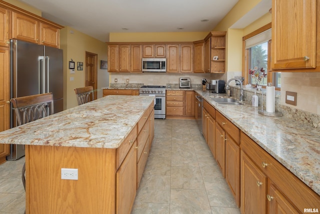 4934 Foxborough Ct, Bettendorf, IA 52722 - kitchen with appliances with stainless steel finishes, light stone countertops, open shelves, a center island, and brown cabinetry