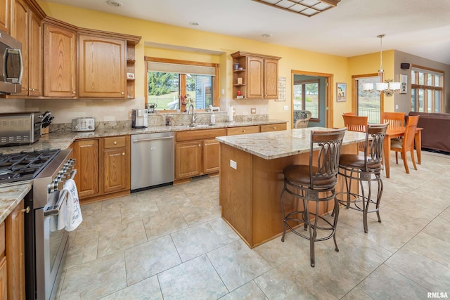 4934 Foxborough Ct, Bettendorf, IA 52722 - kitchen featuring stainless steel appliances, open shelves, a chandelier, plenty of natural light, and recessed lighting