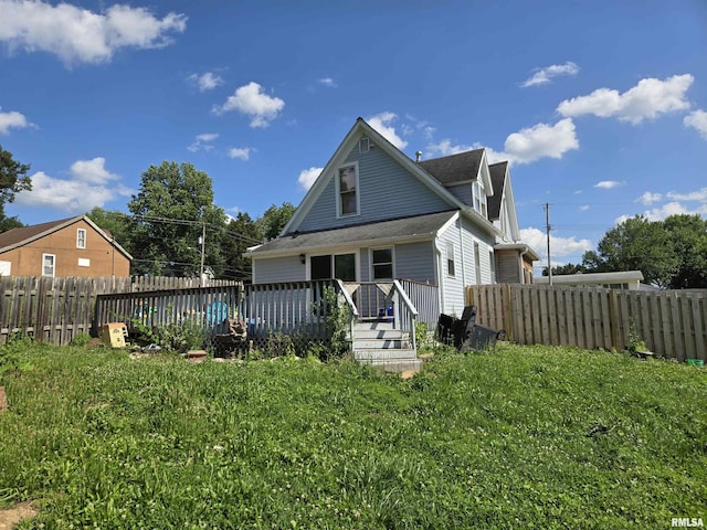 1429 Monroe St, Quincy, IL 62301 - rear view of property with a wooden deck and a fenced backyard