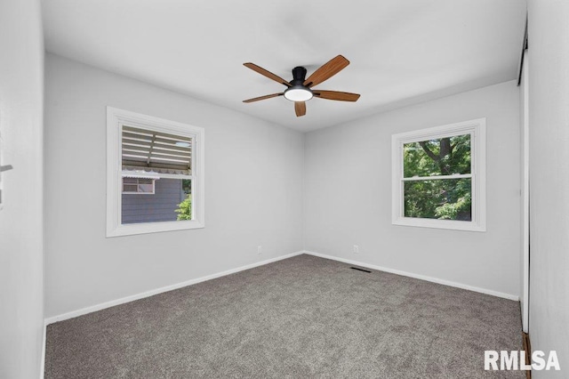 3040 Oak Street Ct, Bettendorf, IA 52722 - empty room featuring ceiling fan and carpet