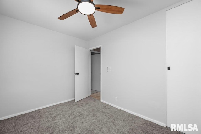 3040 Oak Street Ct, Bettendorf, IA 52722 - unfurnished bedroom with carpet floors and ceiling fan