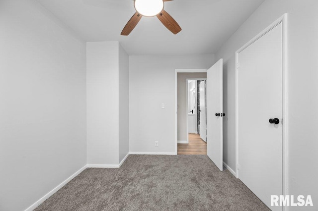 3040 Oak Street Ct, Bettendorf, IA 52722 - unfurnished bedroom featuring carpet floors and ceiling fan