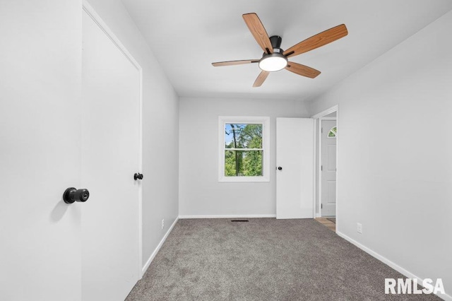 3040 Oak Street Ct, Bettendorf, IA 52722 - spare room featuring carpet floors and ceiling fan