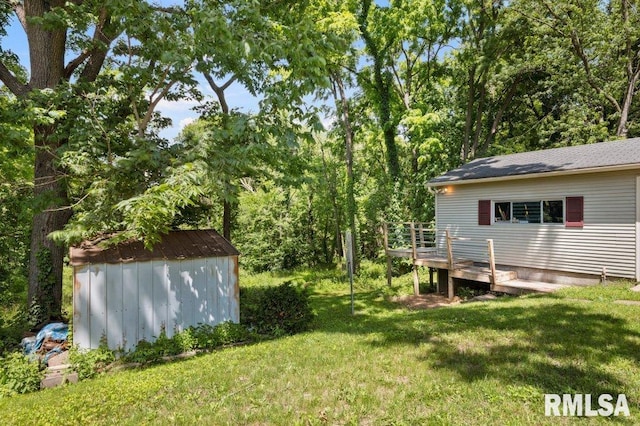3040 Oak Street Ct, Bettendorf, IA 52722 - view of grassy yard with a shed and a deck