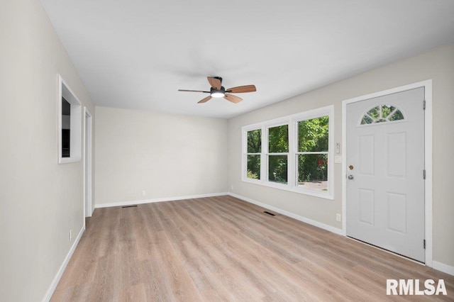 3040 Oak Street Ct, Bettendorf, IA 52722 - foyer with ceiling fan, healthy amount of natural light, and light wood-style flooring