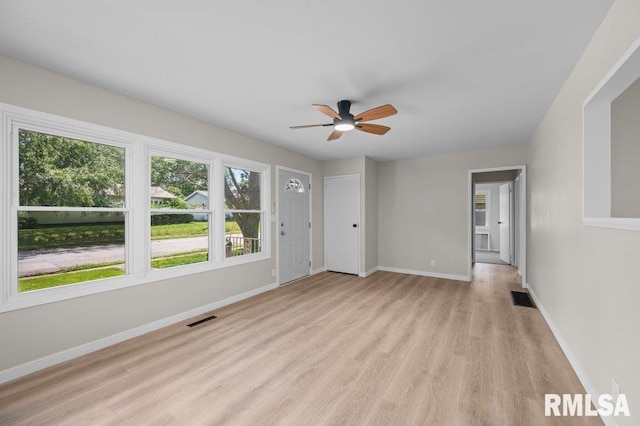 3040 Oak Street Ct, Bettendorf, IA 52722 - empty room featuring light wood-style floors and a ceiling fan