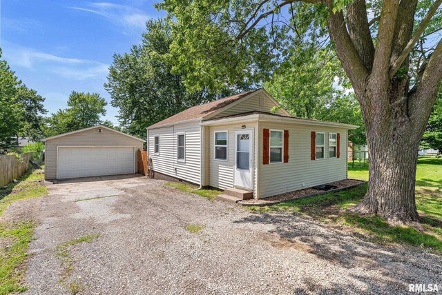 115 4th St, Colona, IL 61241 - view of front facade with a detached garage, an outbuilding, and entry steps