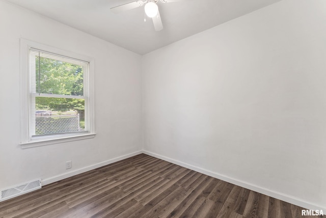 115 4th St, Colona, IL 61241 - spare room featuring dark wood-style flooring and a ceiling fan