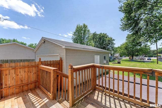115 4th St, Colona, IL 61241 - wooden deck featuring an outbuilding and a garage